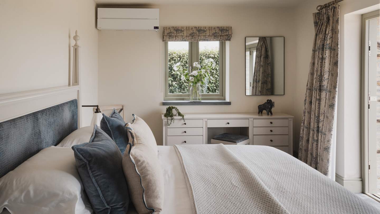 For serene slumbers, bedroom three features a super king size bed swathed in luxury linens and topped with cosy pillows and throws