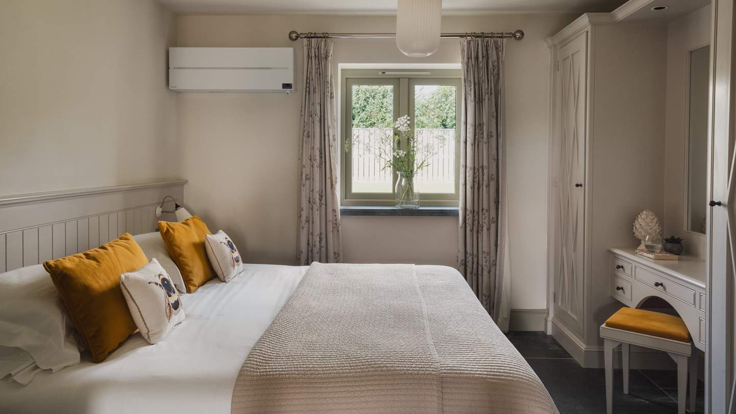 Bedroom four is centred around an irresistibly cosy super-king bed and a sweet dressing table 