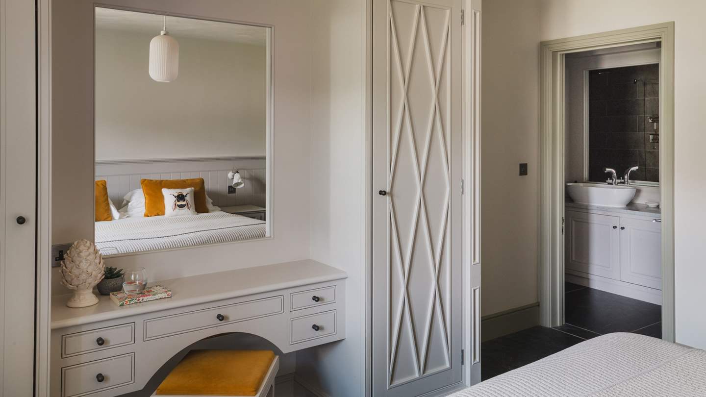 Bedroom four benefits from a spacious en suite shower room 