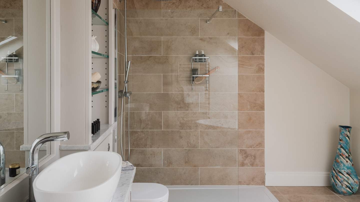 Completing the picture, a luxury en suite with walk in shower and freestanding bath