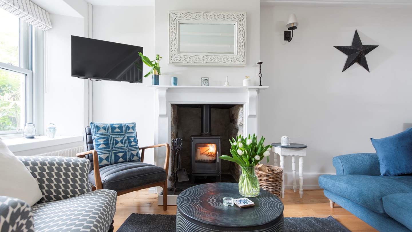 The beautiful sitting room is a joy in shades of blue, grey and white