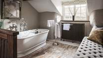 The glorious bath tub for two, set on the mezzanine level, is perfect for bubbly soaks