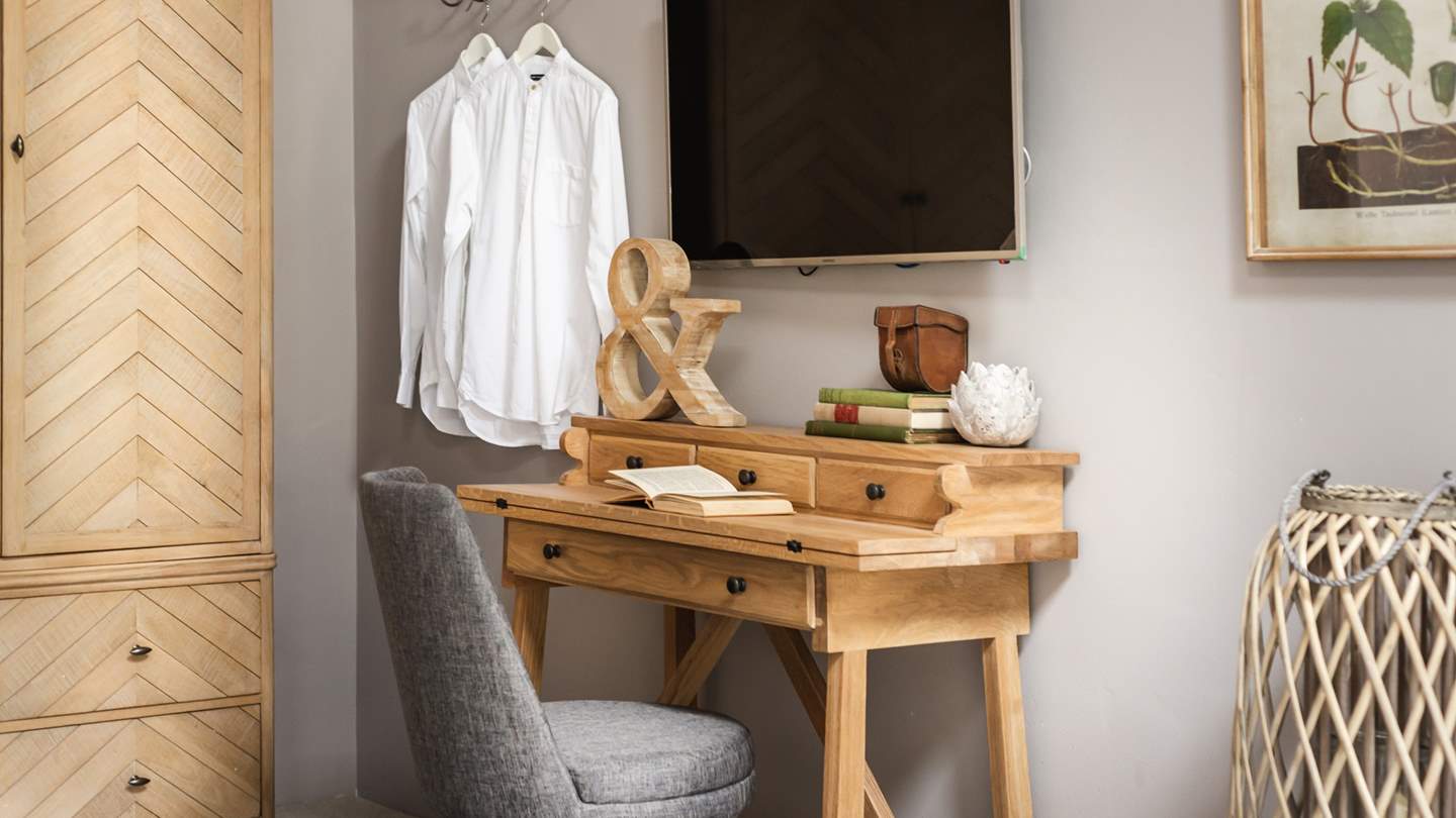 The gorgeous dressing table is also handy if you need to catch up on work (though we don't recommend it...)