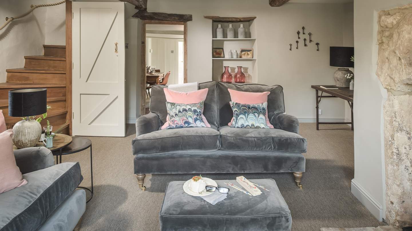 Wooden beamed ceilings, original fireplace and quirky recesses offer plenty of vintage charm