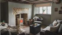 The gorgeous cream wood burner awaits, promising to make the coldest winter's night a cosy delight