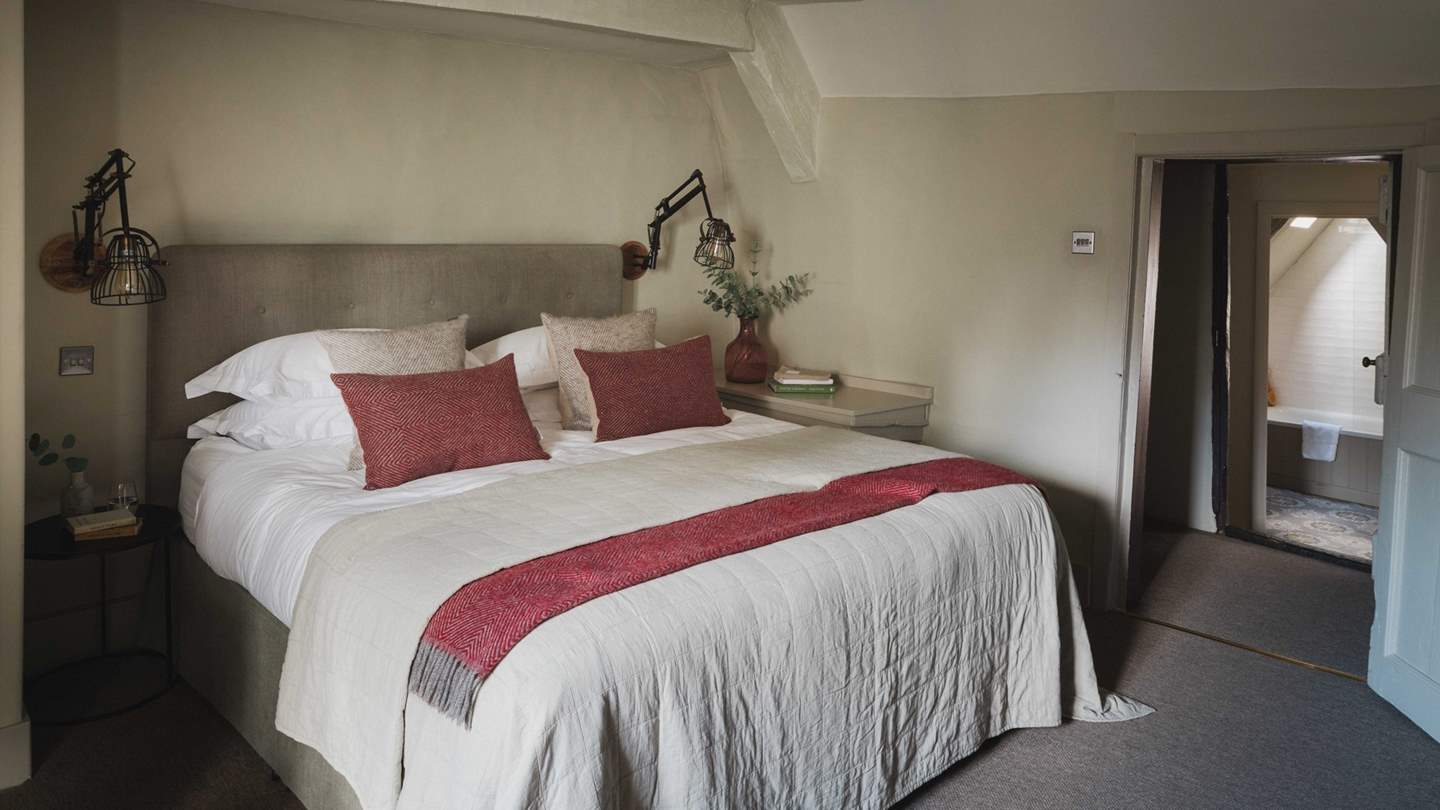The generous Master bedroom boasts a seriously sumptuous super king bed, a wonderful window seat and fireplace
