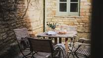 With relaxed seating for four, complete with a table for sun-filled mornings spent alfresco