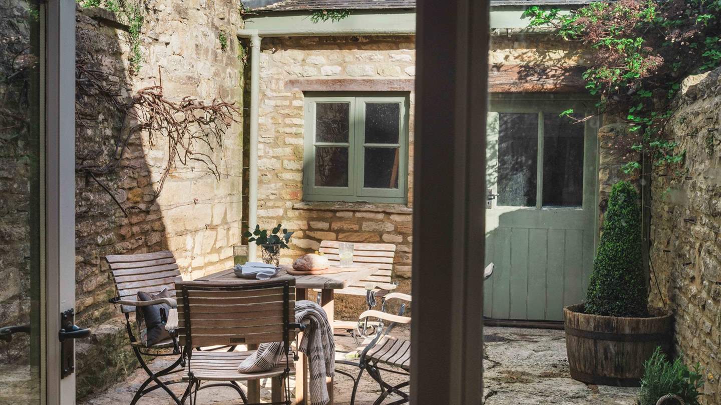 Here you'll find a teak table and matching chairs for peaceful dining outside