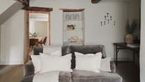 We just love the vintage touches in this room, from the hanging antique keys to the recess shelving