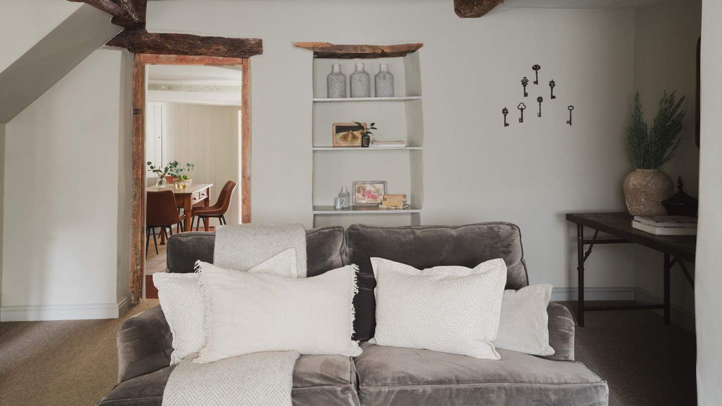 We just love the vintage touches in this room, from the hanging antique keys to the recess shelving