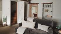 Take the winding wooden stairs up and you'll find two charming bedrooms 

