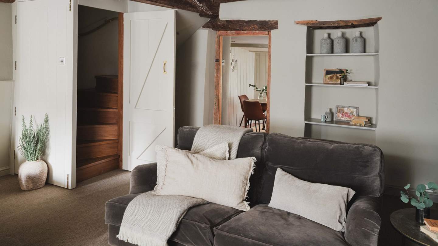 Take the winding wooden stairs up and you'll find two charming bedrooms 

