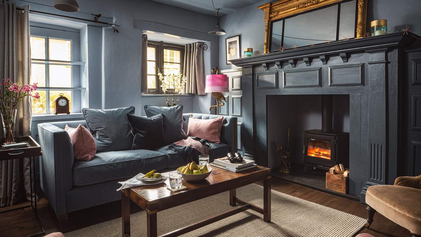 With dreamy blues and sumptuous velvets, the sitting room is a cosy escape to while away an hour or two...