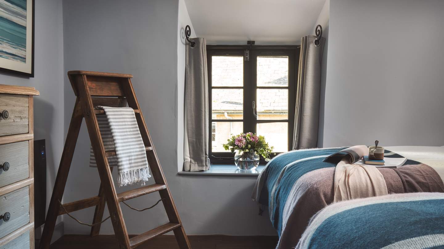 This lovely bedroom also benefits from a Loaf chest of drawers, pretty antiques and a Smart TV