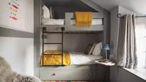 Bedroom four is just darling with cleverly designed carpentry bunks - perfect for little ones to share!