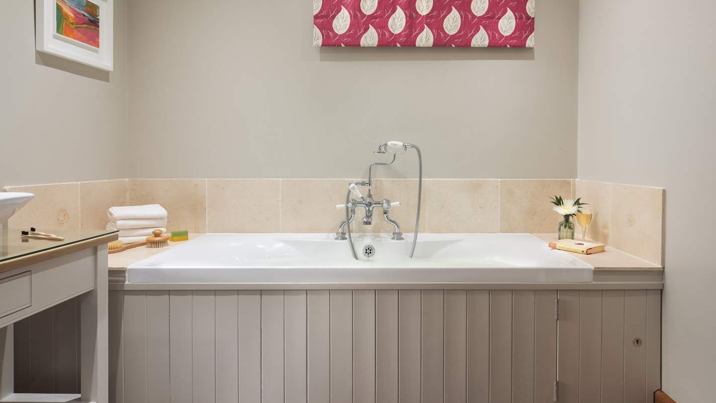 As well as the bath, there's a large, walk in shower