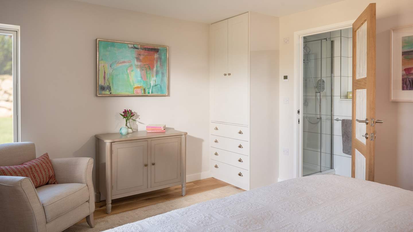 The master bedroom has an en suite shower room