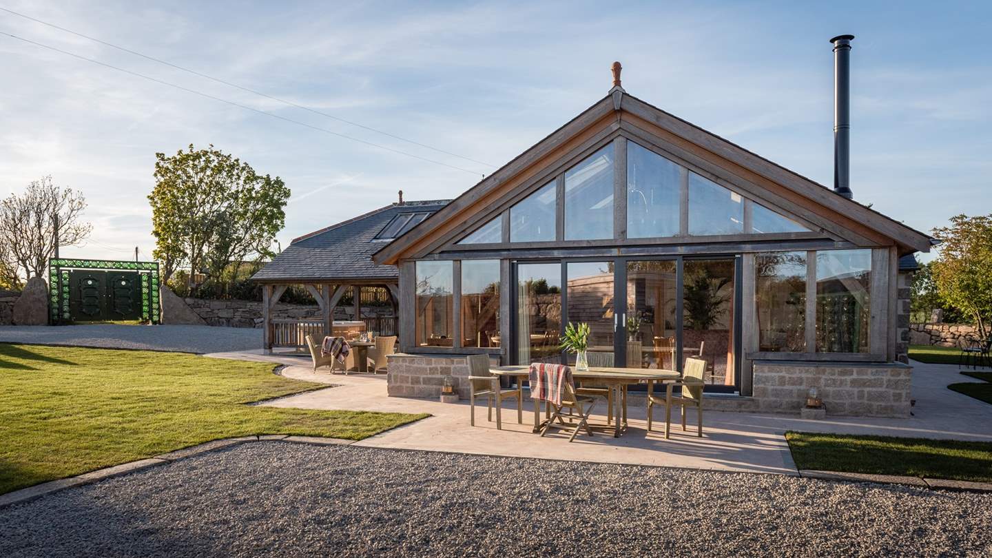 Throw open the large sliding glass doors on to the two sun-soaked terraces, each with a set of tables and chairs