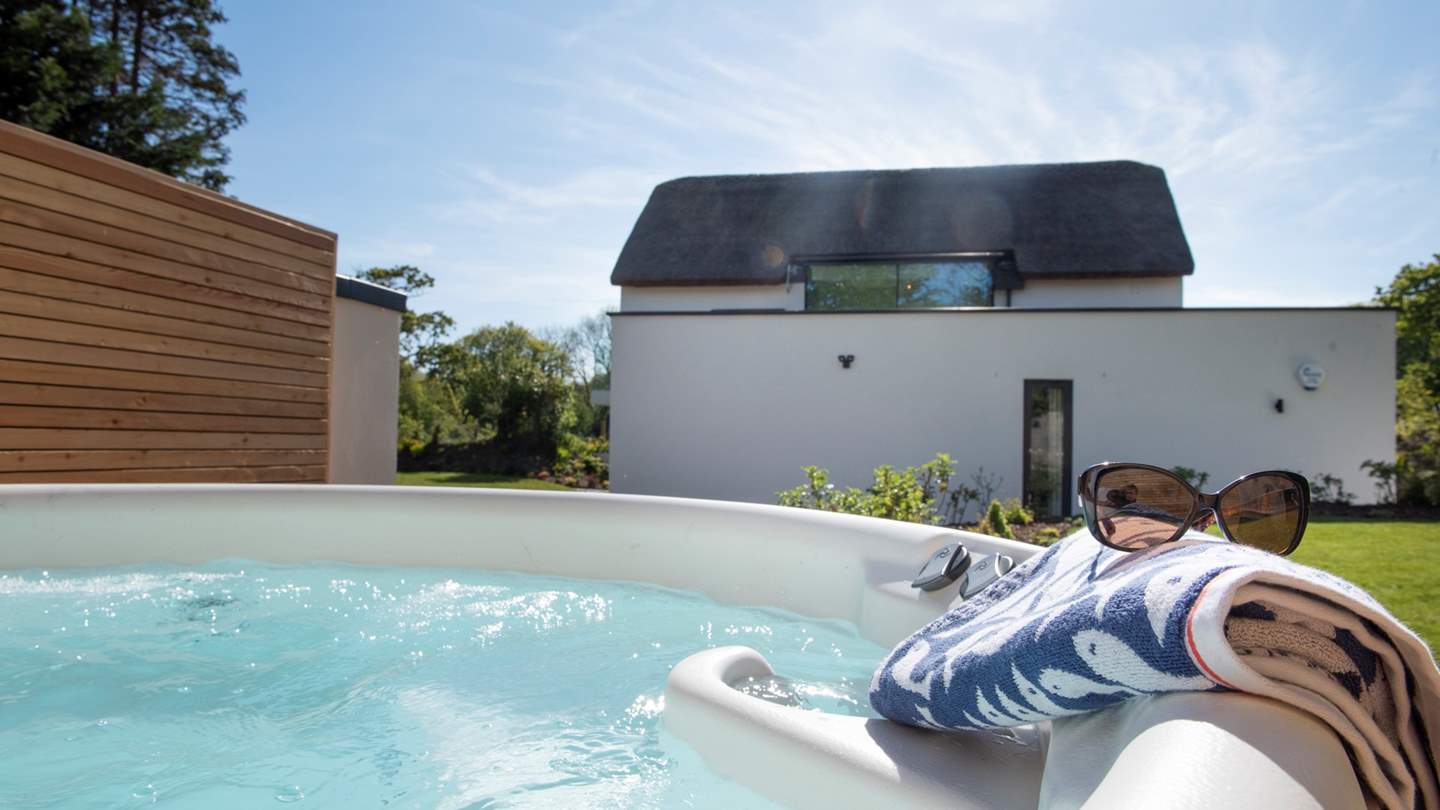Luxuriate in the warm bubbling waters of the secluded hot tub
