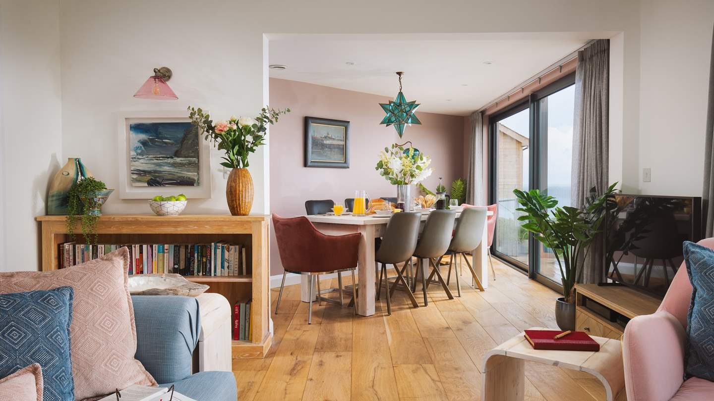 The sitting area has a super-soft five-seater sofa, whilst the three other armchairs offer plenty of additional seating - each with extensive sea views