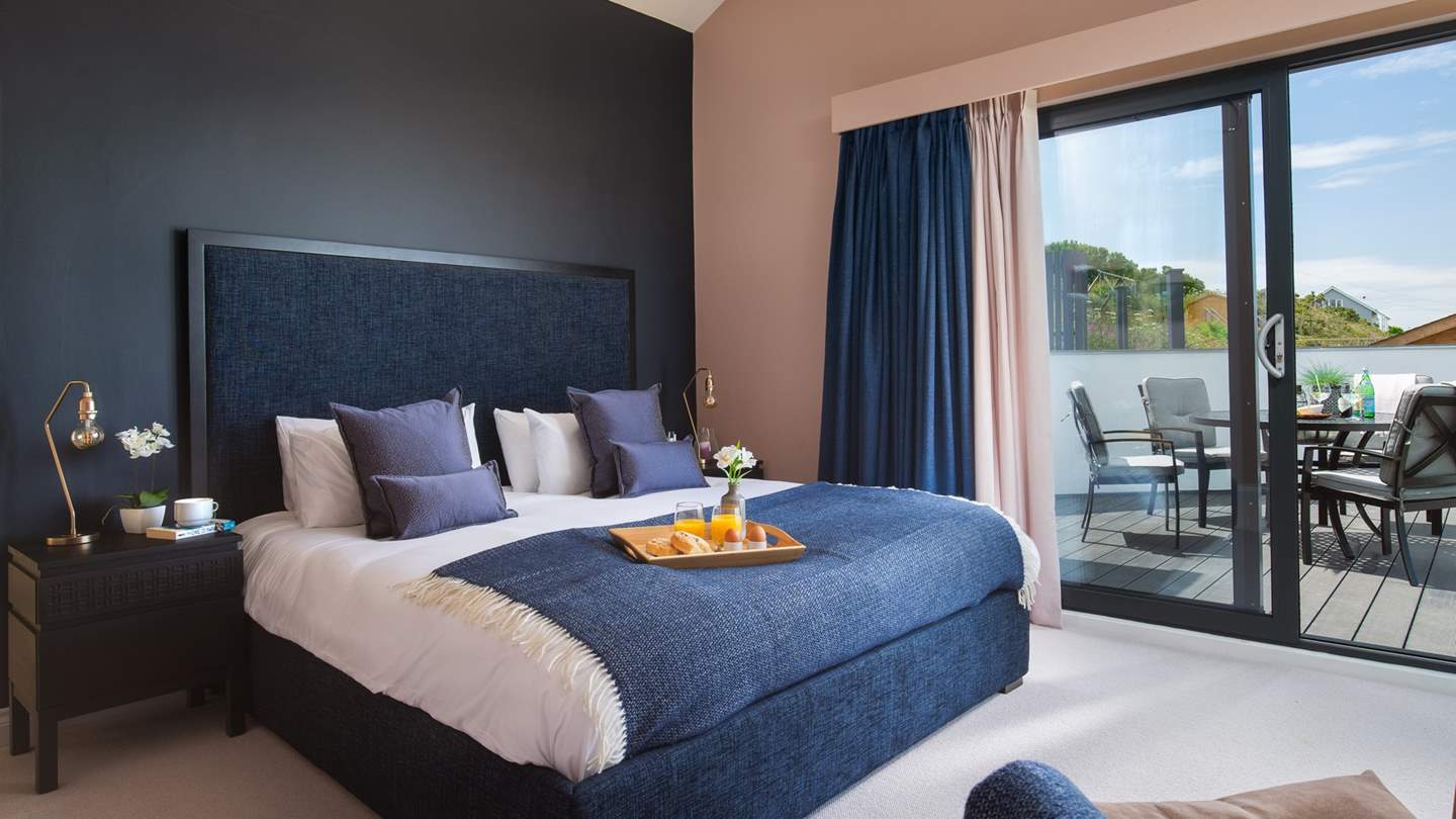 Bedroom one is on the first floor with a super-king size bed, en suite shower room and fabulous sea view terrace