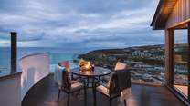 As the sun sets over the village, enjoy the spectacular view from Vincis' fabulous vantage point