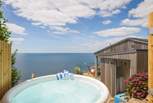 Spend time in the hot tub whilst gazing at the sea