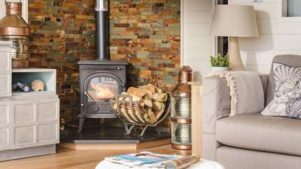 The flickering wood burner is most welcoming during cooler weather