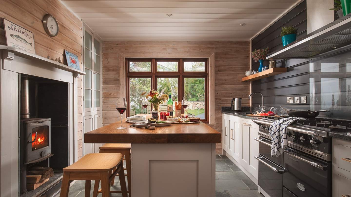 The incredible kitchen is fully equipped with everything you'll need - plus a wood burner!