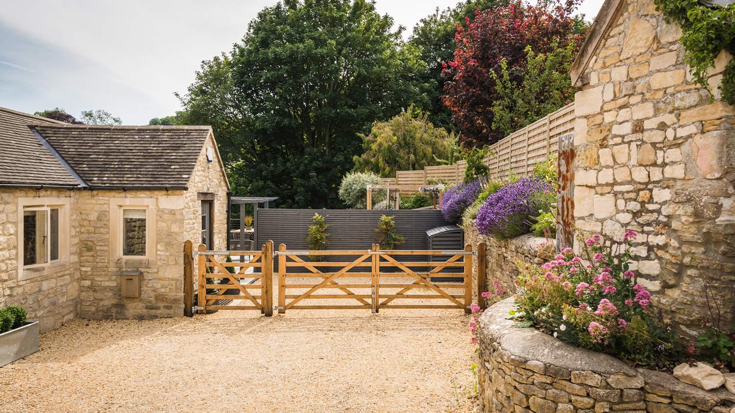 The garden area is gated, and there's parking for two to three cars