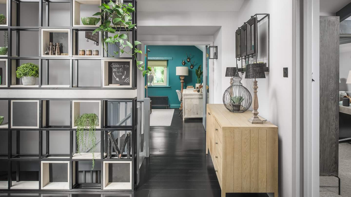 Peeking through to the teal-coloured study and sitting room on the right