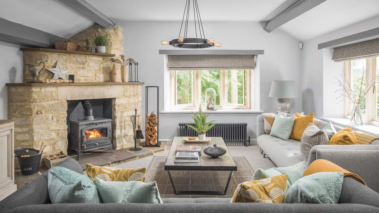 For cooler days, the spacious sitting room is a lovely place to gather around the huge wood burner