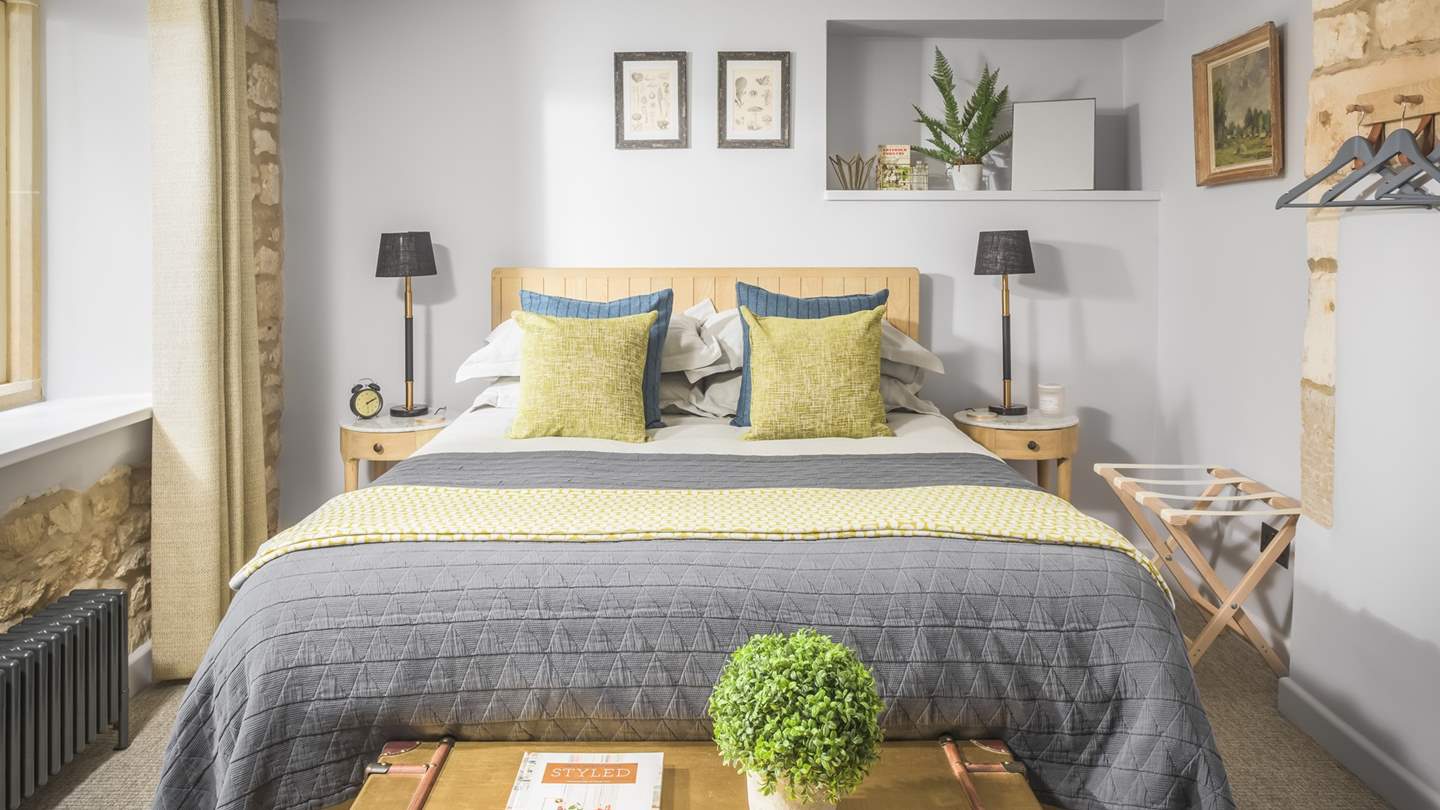 The pretty second bedroom has a king sized bed