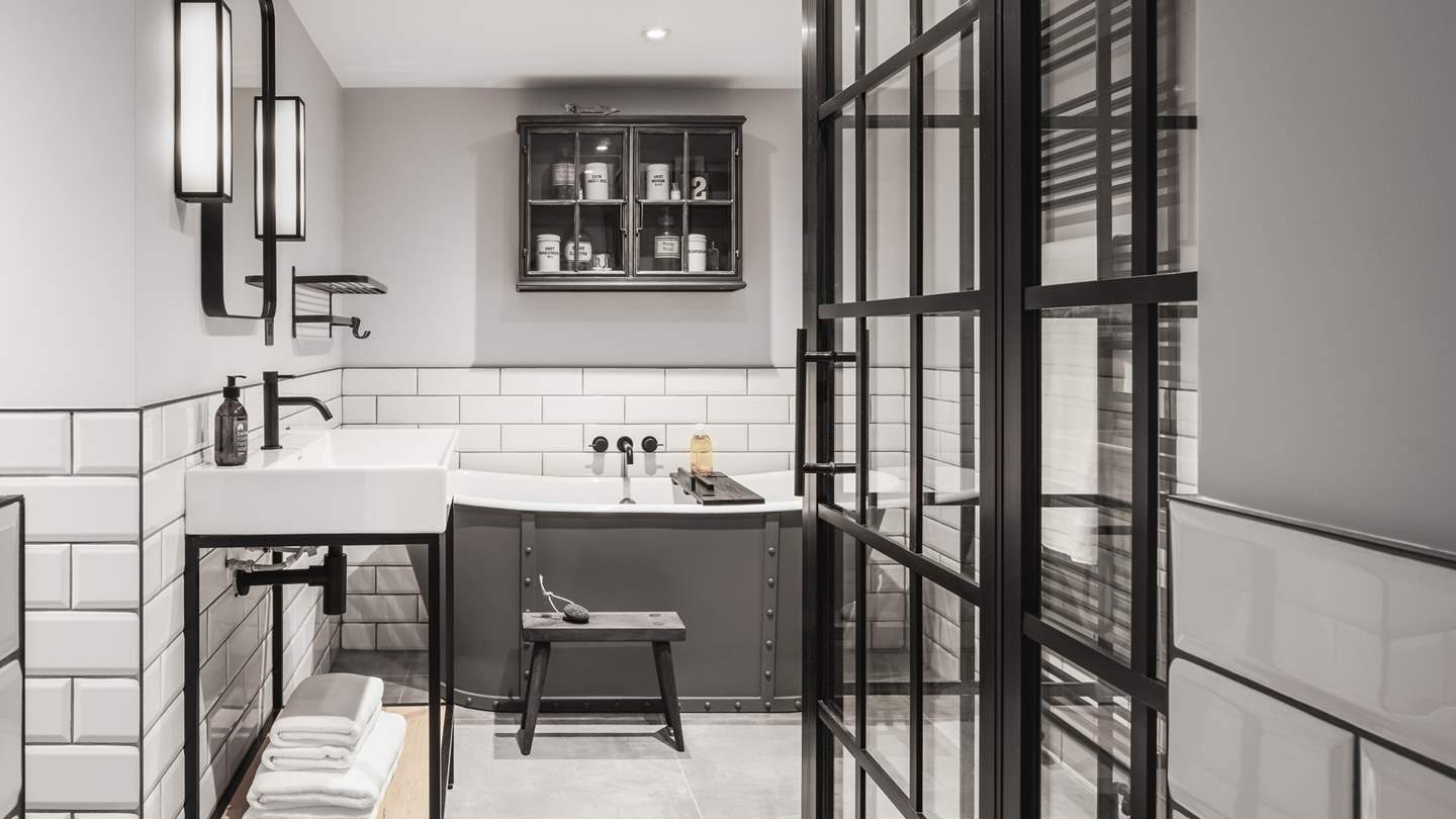 The master bedroom en suite comes complete with bath tub and walk in shower