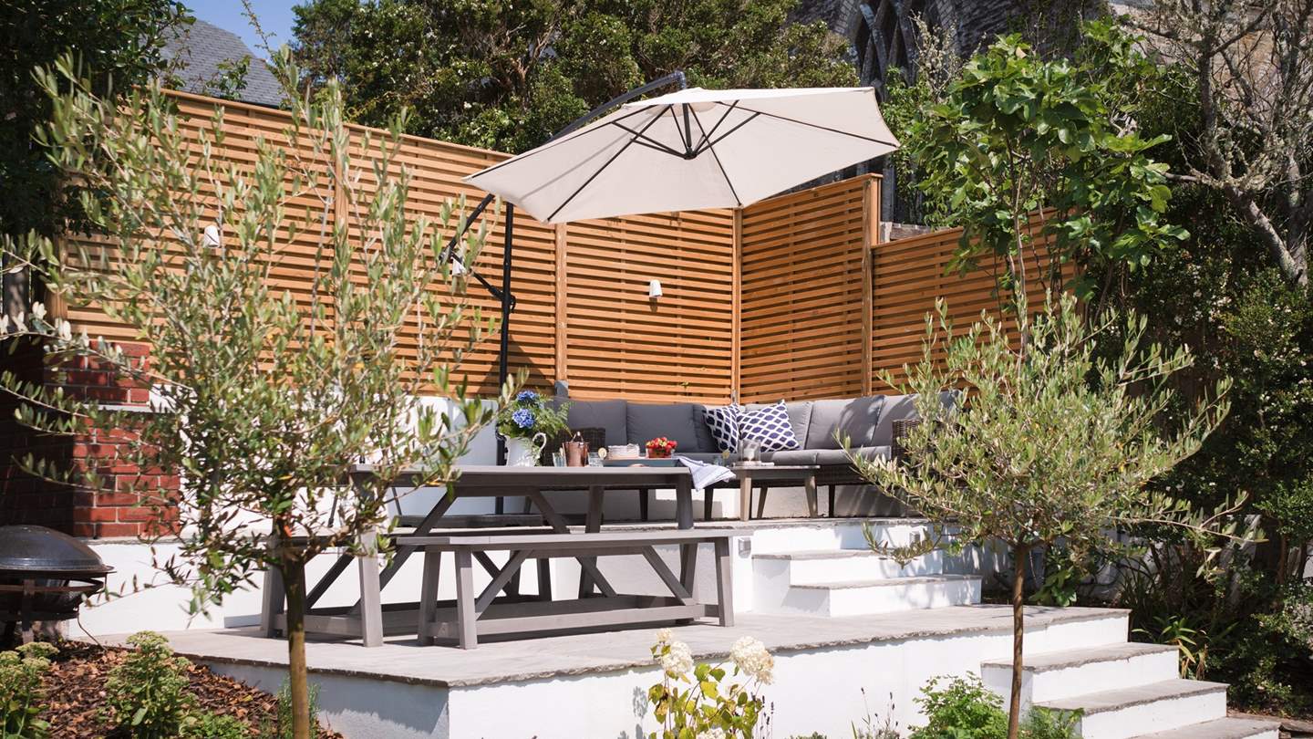 The upper garden seating area is a wonderfully protected spot - perfect for basking in the sun