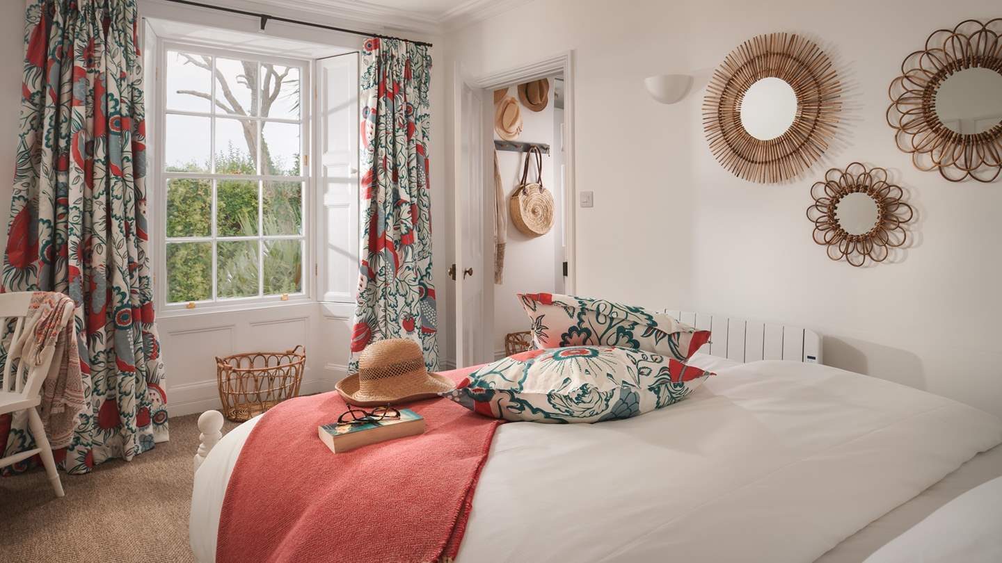 This lovely bedroom has garden views