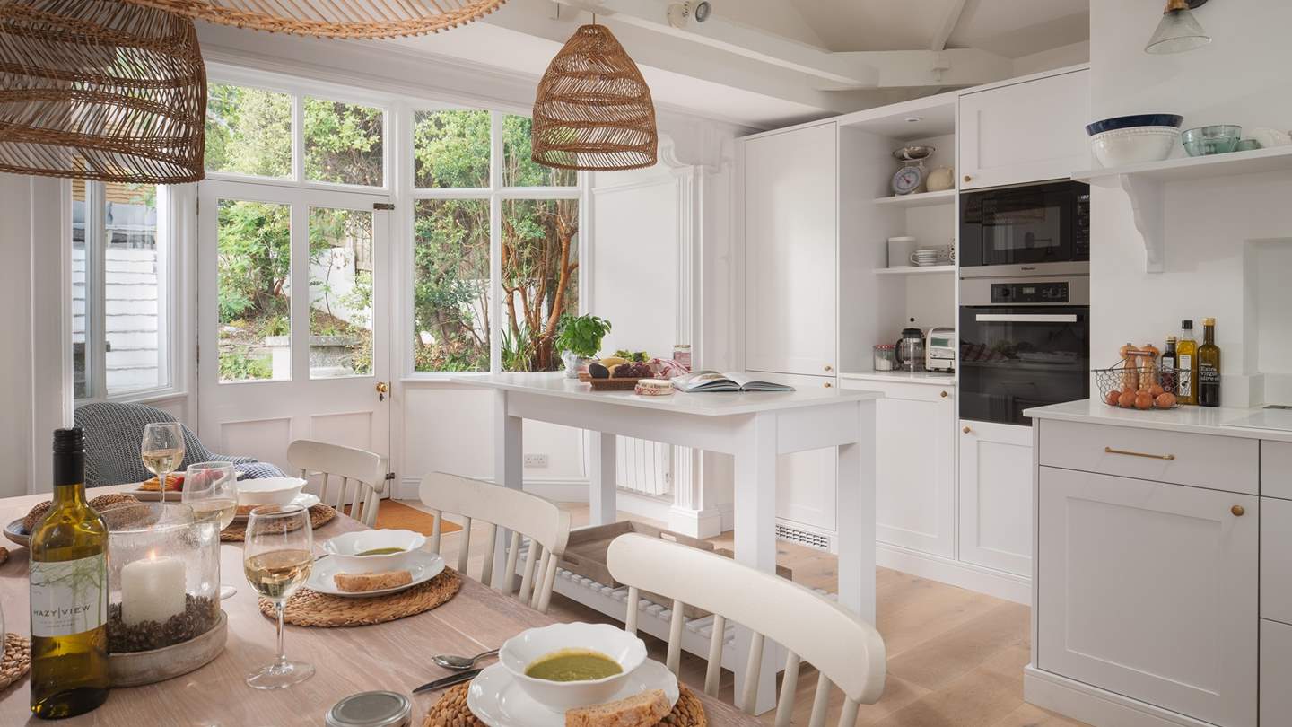 The simple yet fully stocked kitchen has everything you could possibly need