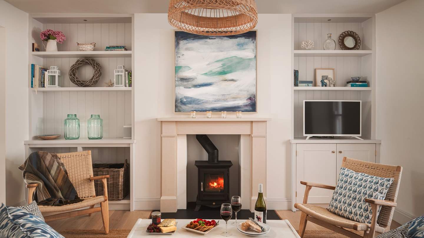 Soft white walls and a gentle nod to the sea with eye-catching lighting and artwork, this is a laid back yet super-stylish room