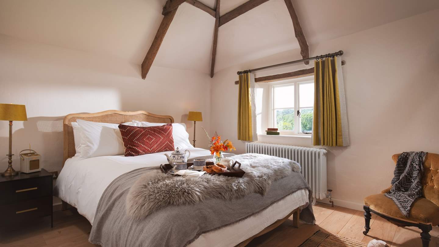 We love the vaulted ceiling and the French-inspired king size bed...so pretty