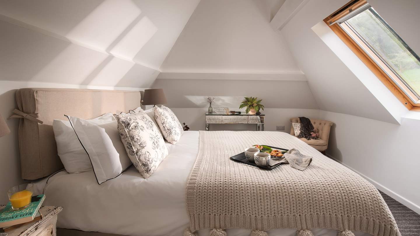 Up in the eaves you'll find a super-romantic county style king size bed