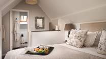Chicly romantic, the bedroom, hidden amongst the eaves, is your own little Eden to retire to at the end of the day
