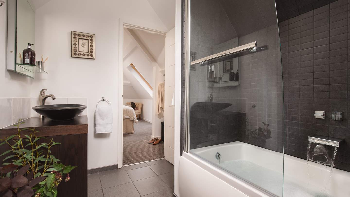 Next to the bedroom you'll find the bathroom complete with a bath, overhead shower and heated rail to keep towels warm and fluffy.