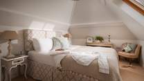 A gorgeously cosy king size bed, this is a blissful escape to retreat to at the end of a busy day exploring