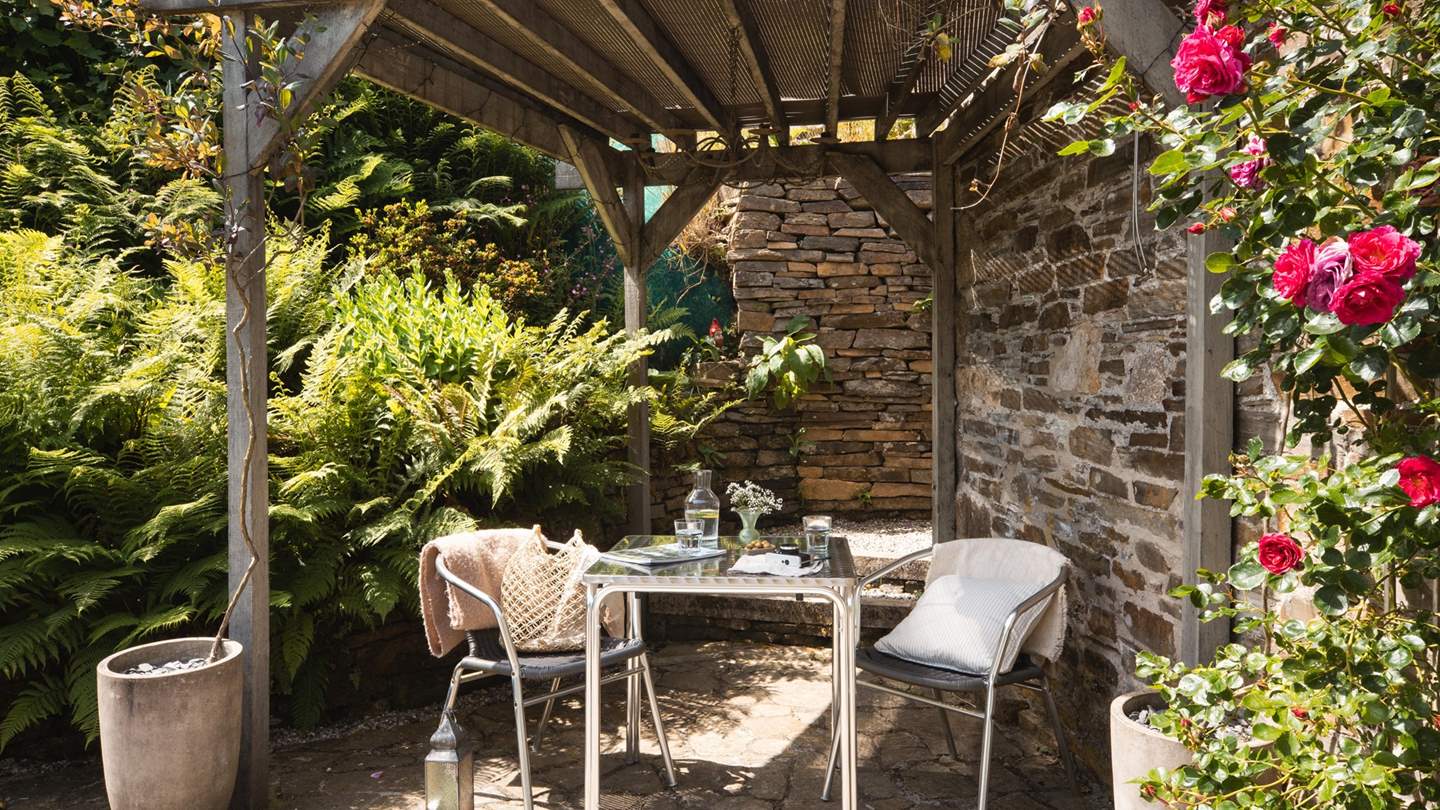 The stunning pergola is the perfect spot to delight in alfresco dining under dusky skies... 