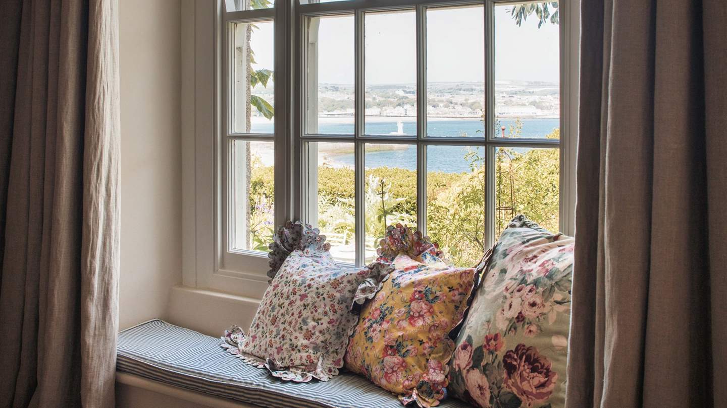 This quaint window seat is the perfect place to settle and watch the gentle lap of waves