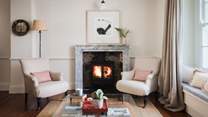 Soothing fireside moments await in the stunning sitting room 