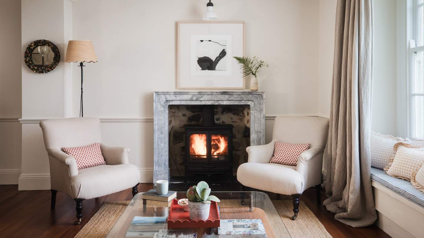 Soothing fireside moments await in the stunning sitting room 