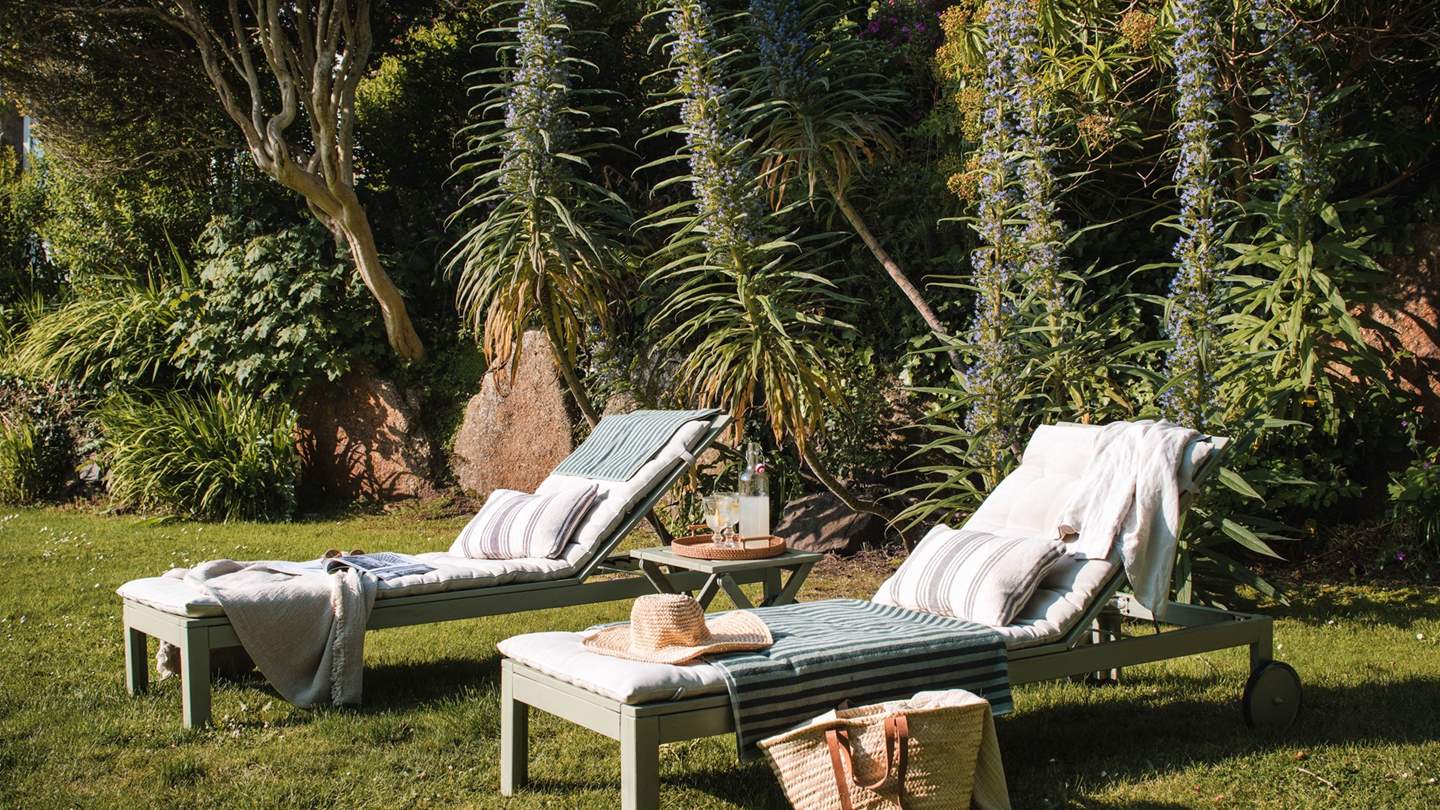 Unwind with your chosen holiday read on the twin loungers...