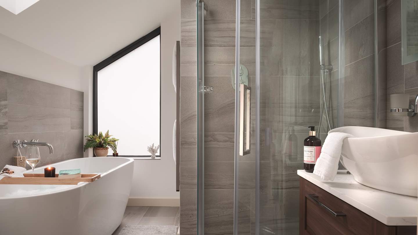 The en suite with decadent bath tub for two and separate shower