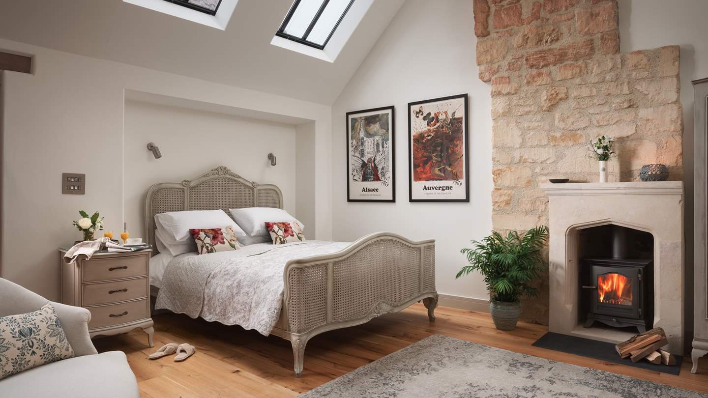 Oh-so-romantic, the exquisite bedroom can be found up the oak and glass stairs